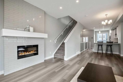 902 Sage Hill Grove Nw, Calgary, AB - Indoor Photo Showing Living Room With Fireplace