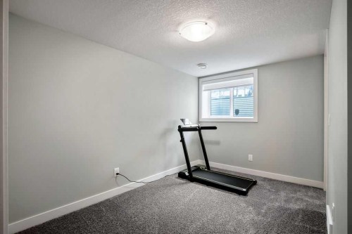 902 Sage Hill Grove Nw, Calgary, AB - Indoor Photo Showing Gym Room