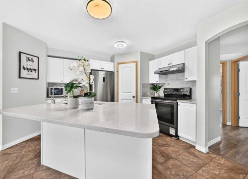 103-160 Panatella Landing Nw, Calgary, AB - Indoor Photo Showing Kitchen With Upgraded Kitchen