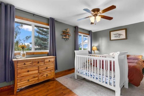 466054 113 Street East, Rural Foothills County, AB - Indoor Photo Showing Bedroom