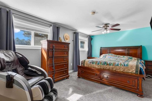 466054 113 Street East, Rural Foothills County, AB - Indoor Photo Showing Bedroom
