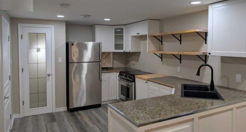 2614 44 Street Se, Calgary, AB - Indoor Photo Showing Kitchen With Double Sink