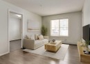 113-2715 12 Avenue Se, Calgary, AB  - Indoor Photo Showing Living Room 