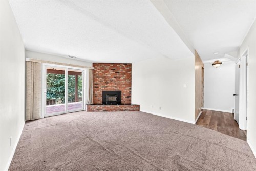 5820 Dalridge Hill Nw, Calgary, AB - Indoor Photo Showing Living Room With Fireplace