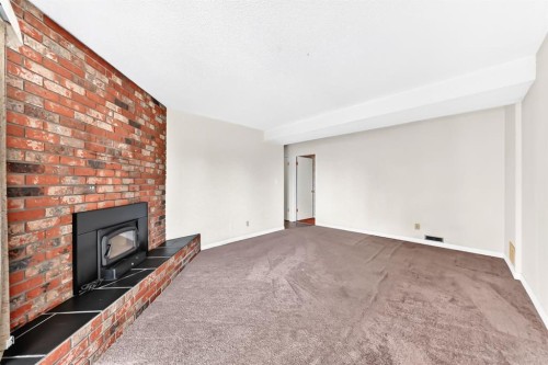 5820 Dalridge Hill Nw, Calgary, AB - Indoor Photo Showing Other Room With Fireplace