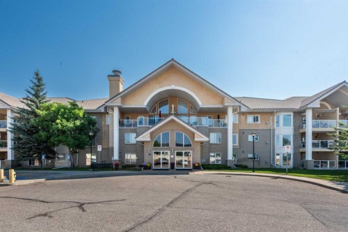 304-728 Country Hills Road Nw, Calgary, AB - Outdoor With Balcony With Facade