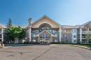 304-728 Country Hills Road Nw, Calgary, AB  - Outdoor With Balcony With Facade 