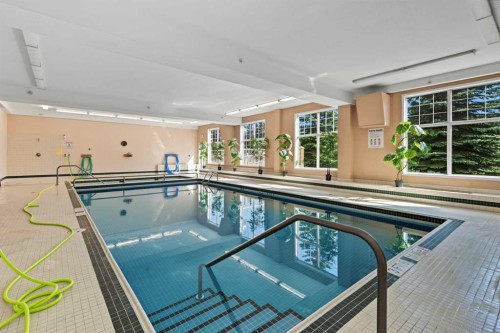 304-728 Country Hills Road Nw, Calgary, AB - Indoor Photo Showing Other Room With In Ground Pool