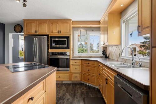 281014-274 Range Road, Rural Rocky View County, AB - Indoor Photo Showing Kitchen With Stainless Steel Kitchen With Double Sink
