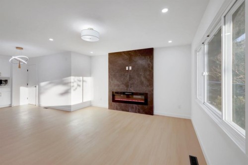 1174 Abbeydale Drive Ne, Calgary, AB - Indoor With Fireplace