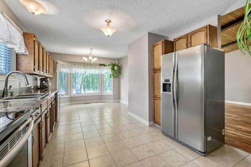 163 Woodburn Crescent, Okotoks, AB - Indoor Photo Showing Kitchen With Double Sink