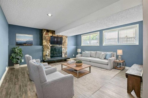163 Woodburn Crescent, Okotoks, AB - Indoor Photo Showing Living Room With Fireplace