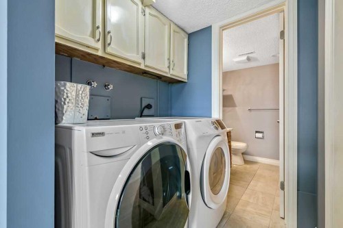 163 Woodburn Crescent, Okotoks, AB - Indoor Photo Showing Laundry Room
