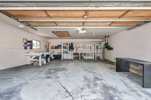 163 Woodburn Crescent, Okotoks, AB - Indoor Photo Showing Garage