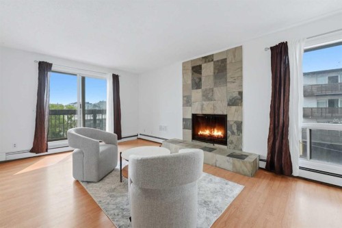 306-2611 15A Street Sw, Calgary, AB - Indoor Photo Showing Living Room With Fireplace