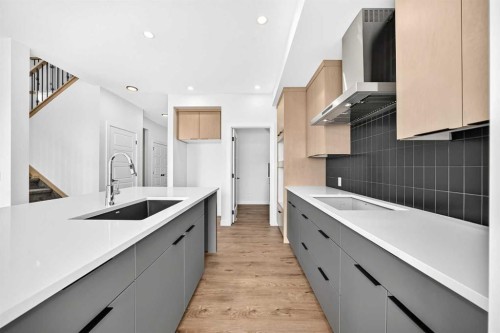 199 Langwell Common Se, Airdrie, AB - Indoor Photo Showing Kitchen With Upgraded Kitchen