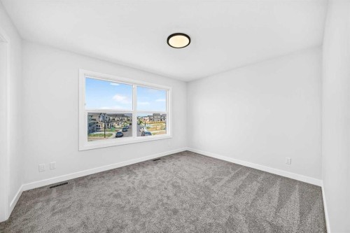 199 Langwell Common Se, Airdrie, AB - Indoor Photo Showing Other Room