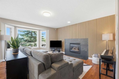 12078 Diamond View Se, Calgary, AB - Indoor Photo Showing Living Room With Fireplace