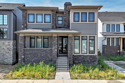 74 Alpine Gardens Sw, Calgary, AB - Outdoor With Facade