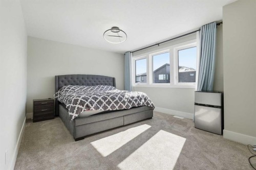 74 Alpine Gardens Sw, Calgary, AB - Indoor Photo Showing Bedroom