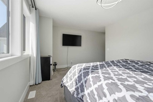 74 Alpine Gardens Sw, Calgary, AB - Indoor Photo Showing Bedroom