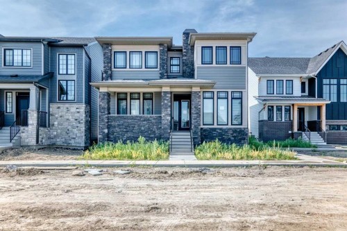 74 Alpine Gardens Sw, Calgary, AB - Outdoor With Facade