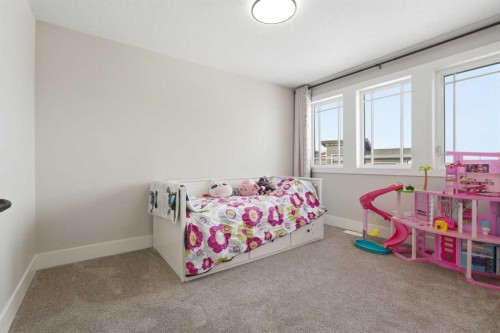 74 Alpine Gardens Sw, Calgary, AB - Indoor Photo Showing Bedroom