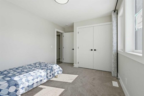 74 Alpine Gardens Sw, Calgary, AB - Indoor Photo Showing Bedroom