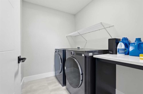 74 Alpine Gardens Sw, Calgary, AB - Indoor Photo Showing Laundry Room