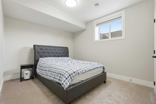 74 Alpine Gardens Sw, Calgary, AB - Indoor Photo Showing Bedroom