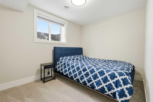74 Alpine Gardens Sw, Calgary, AB - Indoor Photo Showing Bedroom