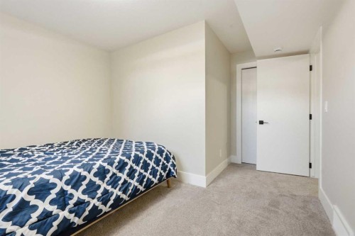 74 Alpine Gardens Sw, Calgary, AB - Indoor Photo Showing Bedroom