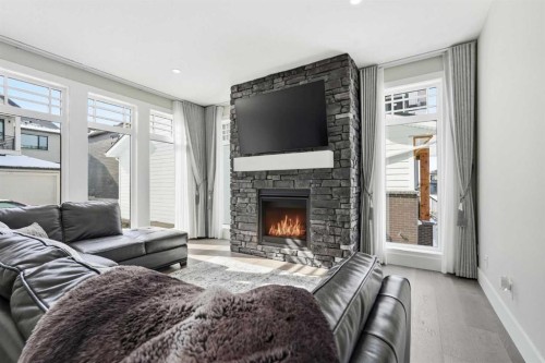 74 Alpine Gardens Sw, Calgary, AB - Indoor Photo Showing Living Room With Fireplace