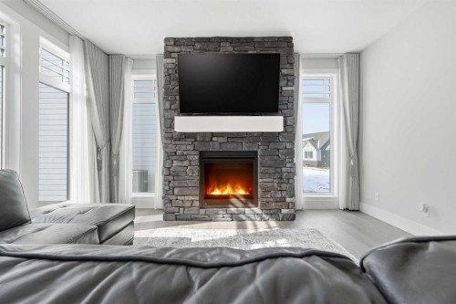 74 Alpine Gardens Sw, Calgary, AB - Indoor Photo Showing Living Room With Fireplace