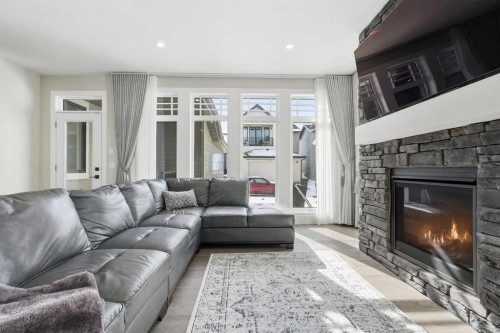 74 Alpine Gardens Sw, Calgary, AB - Indoor Photo Showing Living Room With Fireplace