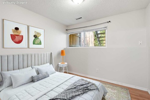 4-126 Mcrae Street, Okotoks, AB - Indoor Photo Showing Bedroom