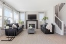 4 Heritage Terrace, Cochrane, AB  - Indoor Photo Showing Living Room With Fireplace 
