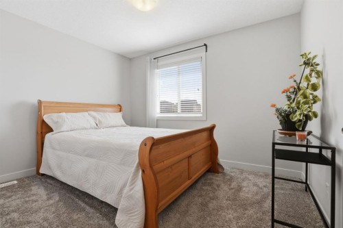 4 Heritage Terrace, Cochrane, AB - Indoor Photo Showing Bedroom