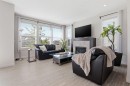 4 Heritage Terrace, Cochrane, AB  - Indoor Photo Showing Living Room With Fireplace 