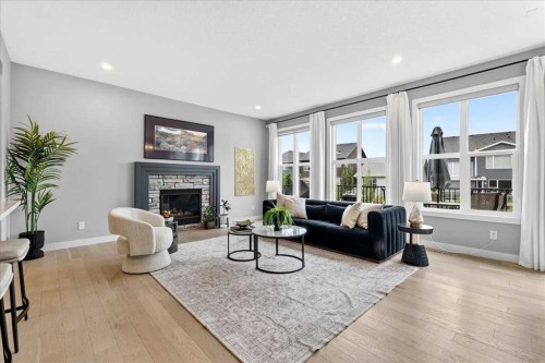 137 Cranbrook Cove Se, Calgary, AB - Indoor Photo Showing Living Room With Fireplace