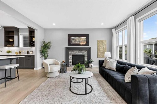 137 Cranbrook Cove Se, Calgary, AB - Indoor Photo Showing Living Room With Fireplace
