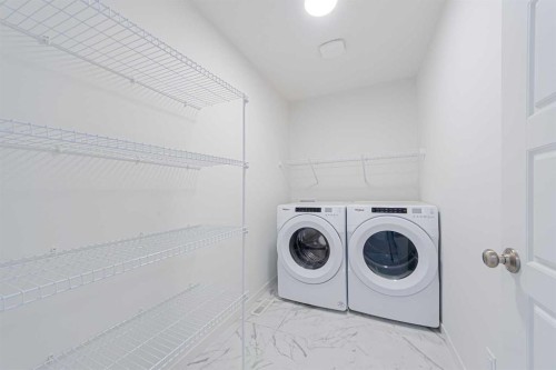 186 Aquila Drive Nw, Calgary, AB - Indoor Photo Showing Laundry Room