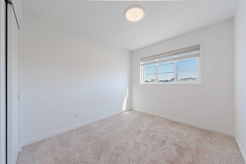 186 Aquila Drive Nw, Calgary, AB - Indoor Photo Showing Other Room