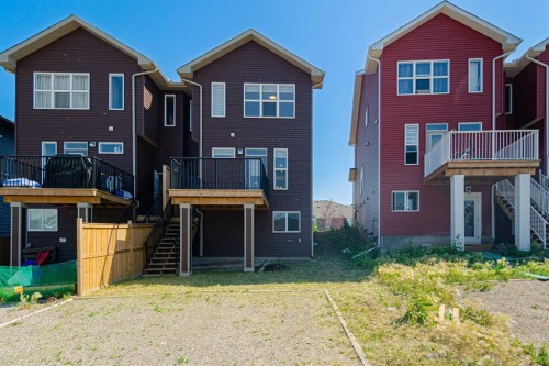 186 Aquila Drive Nw, Calgary, AB - Outdoor With Facade