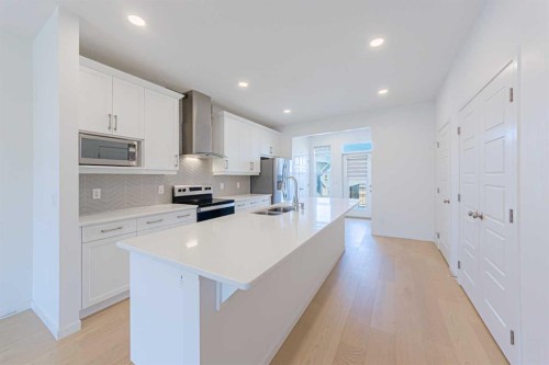 186 Aquila Drive Nw, Calgary, AB - Indoor Photo Showing Kitchen With Double Sink With Upgraded Kitchen