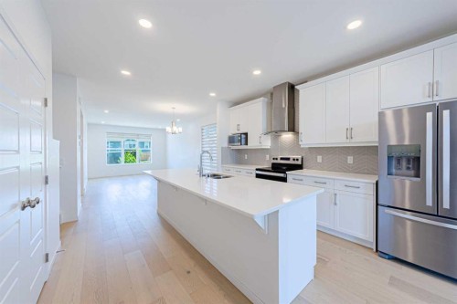 186 Aquila Drive Nw, Calgary, AB - Indoor Photo Showing Kitchen With Stainless Steel Kitchen With Double Sink With Upgraded Kitchen