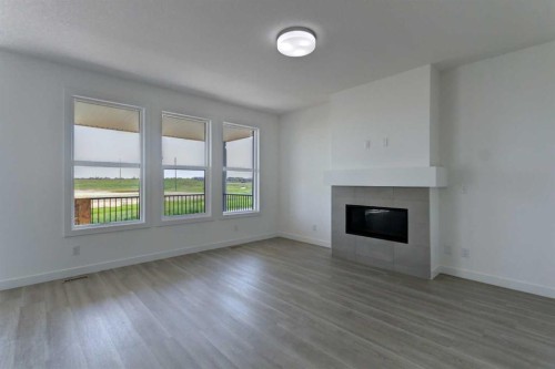 160 Copperhead Road Se, Calgary, AB - Indoor Photo Showing Living Room With Fireplace