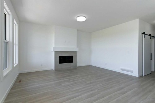 160 Copperhead Road Se, Calgary, AB - Indoor With Fireplace
