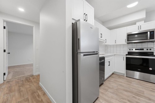 20305 45 Street Se, Calgary, AB - Indoor Photo Showing Kitchen With Stainless Steel Kitchen