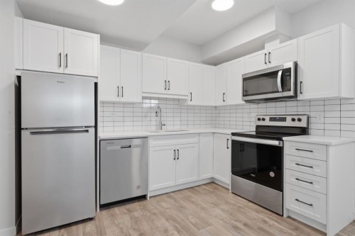 20305 45 Street Se, Calgary, AB - Indoor Photo Showing Kitchen With Stainless Steel Kitchen With Upgraded Kitchen